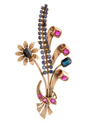 Lot 208 - A rose gold (tests 9ct) ruby and sapphire set floral spray brooch.