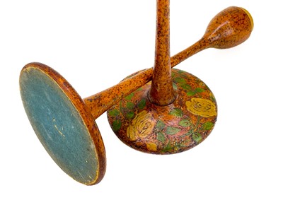 Lot 81 - A pair of Arts and Crafts style poker work candlesticks.
