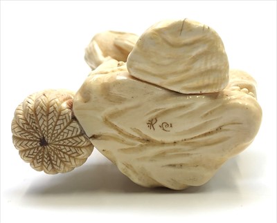 Lot 172 - A Japanese ivory okimono of a toad catcher,...