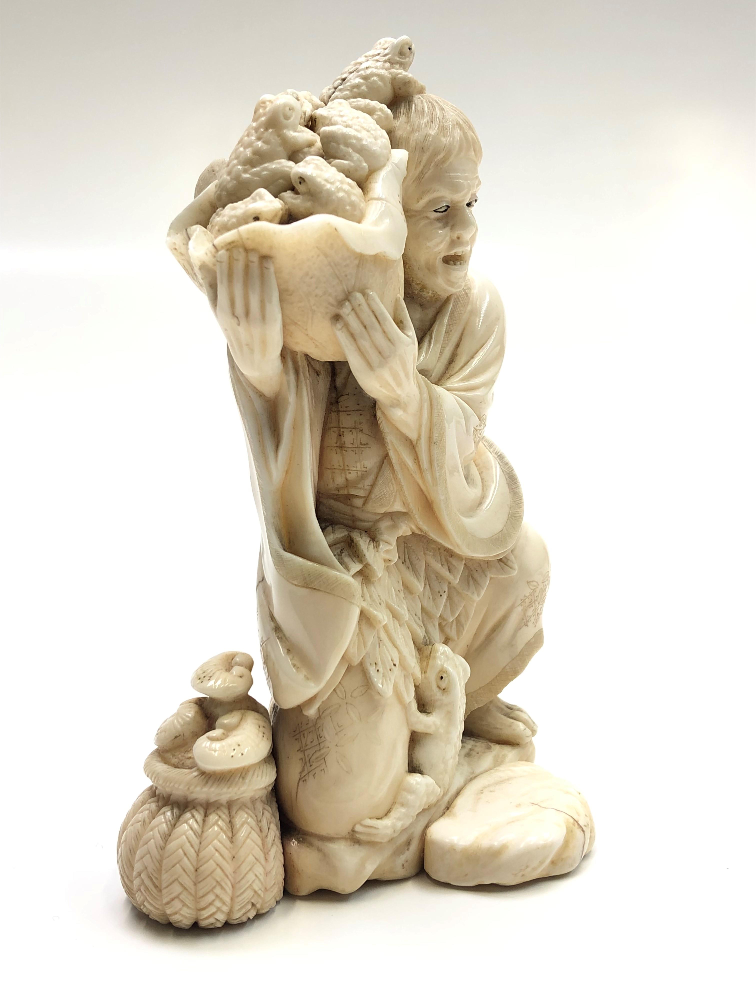 lot-172-a-japanese-ivory-okimono-of-a-toad-catcher