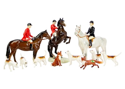 Lot 591 - A Beswick Huntsman on a rearing horse.