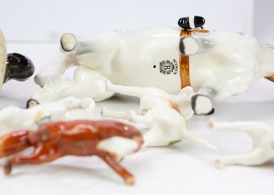 Lot 591 - A Beswick Huntsman on a rearing horse.