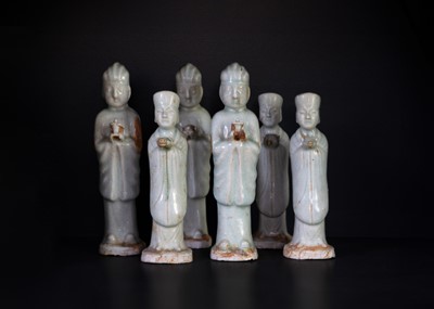 Lot 174 - Six Chinese celadon glazed pottery figures, probably Yuan Dynasty.