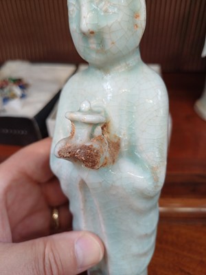 Lot 705 - Six Chinese celadon glazed pottery figures, probably Yuan Dynasty.