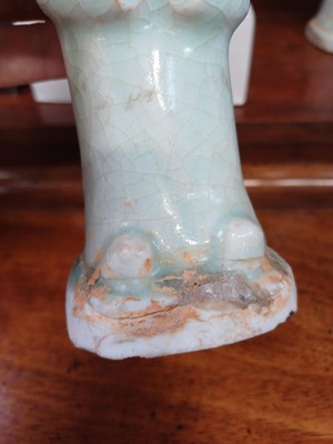 Lot 705 - Six Chinese celadon glazed pottery figures, probably Yuan Dynasty.