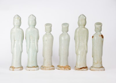 Lot 705 - Six Chinese celadon glazed pottery figures, probably Yuan Dynasty.