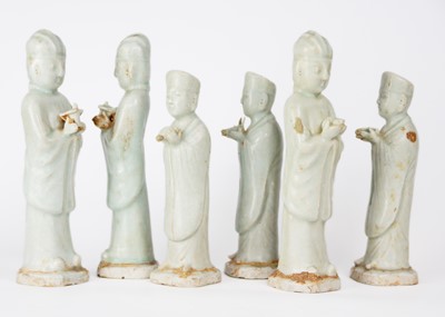 Lot 705 - Six Chinese celadon glazed pottery figures, probably Yuan Dynasty.