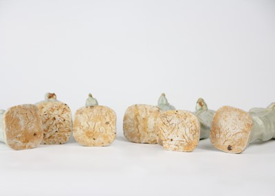 Lot 705 - Six Chinese celadon glazed pottery figures, probably Yuan Dynasty.