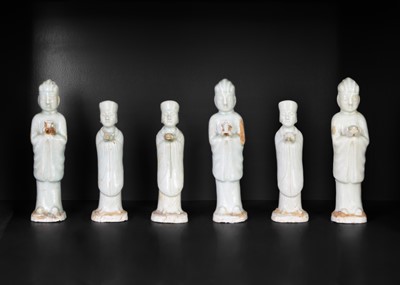 Lot 705 - Six Chinese celadon glazed pottery figures, probably Yuan Dynasty.
