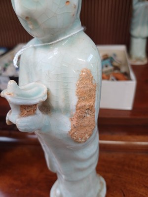 Lot 705 - Six Chinese celadon glazed pottery figures, probably Yuan Dynasty.