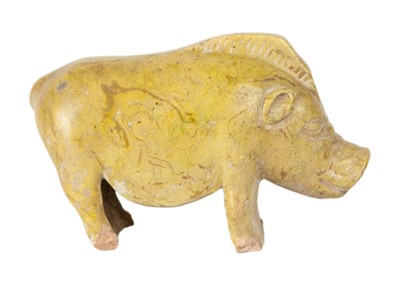 Lot 175 - A Chinese Han style pottery glazed model of a pig.