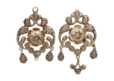 Lot 165 - A pair of Georgian silver, gold-backed, pendant earrings set with a central rose cut diamond.