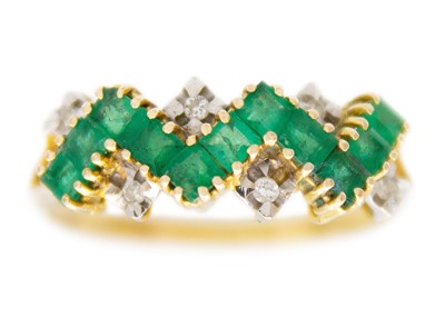 Lot 161 - A 14ct emerald and diamond set dress ring.