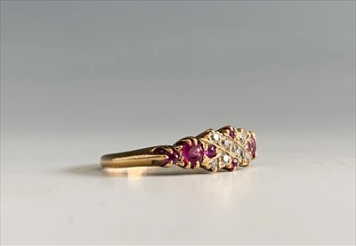 Lot 2490 - An 18ct ruby and diamond set ring.