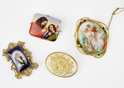 Lot 296 - A collection of four 19th-century painted porcelain brooches.