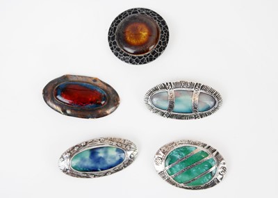 Lot 242 - A collection of five Arts & Craft Ruskin style enamel brooches.