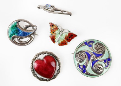 Lot 253 - A collection of five silver and enamel brooches.