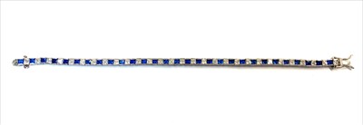 Lot 2477 - A paste set line bracelet.