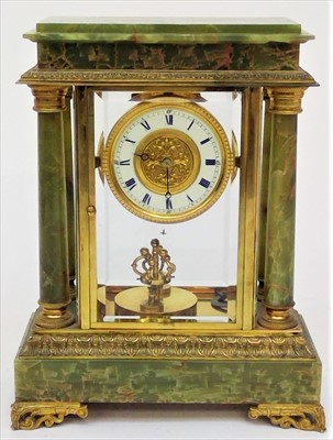 Lot 3322 - A green onyx torsion anniversary mantle clock,...