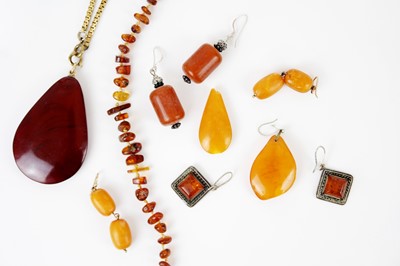 Lot 305 - A collection of amber and amber-style jewellery.