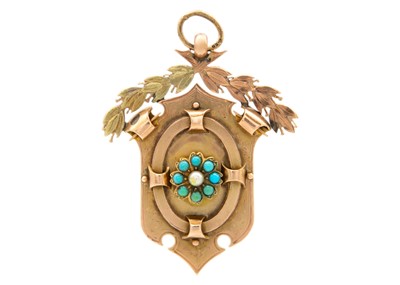 Lot 244 - A Victorian 9ct bi-colour gold turquoise and seed pearl set shield fob.