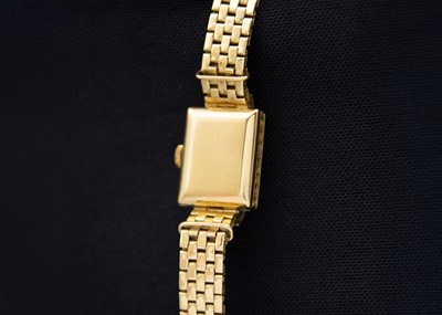 Lot 150 - OMEGA - An 18ct lady's manual wind diamond set bracelet wristwatch.