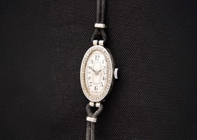 Lot 50 - An Art Deco platinum diamond set manual wind lady's cocktail watch.