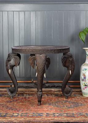 Lot 229 - An Indian carved hardwood occasional table, 19th century.