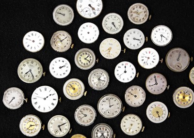 Lot 181 - A quantity of mid-sized circular manual wind wristwatch movements and dials for repairs and spares.