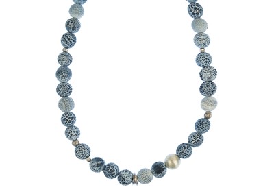 Lot 78 - A contemporary volcanic blue and white stone and silver bead necklace.