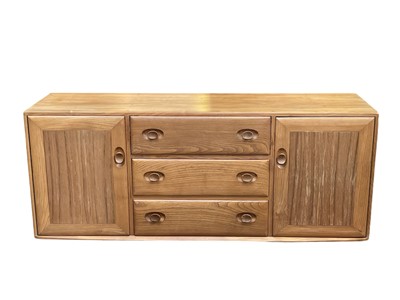 Lot 431 - An Ercol light elm Windsor sideboard.