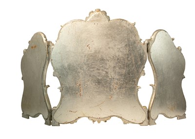 Lot 580 - A rococo style silvered triptych dressing table mirror.