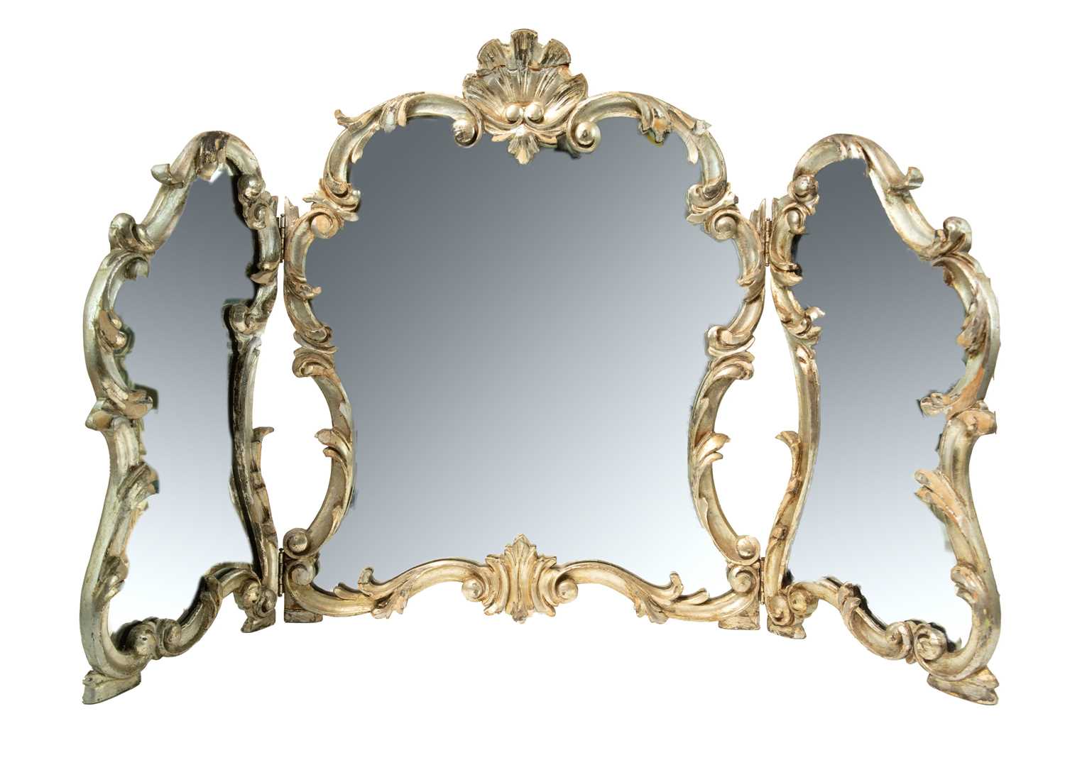 Lot 580 - A rococo style silvered triptych dressing table mirror.