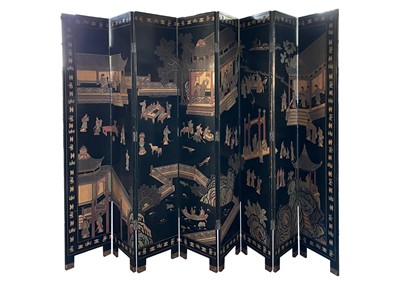 Lot 219 - A Chinese black lacquered screen, early 20th century.