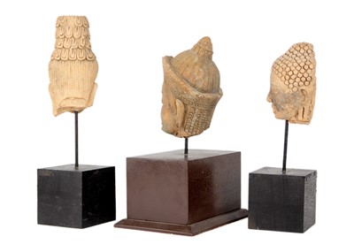 Lot 224 - Three Cambodian/Thai Buddhist pottery heads.