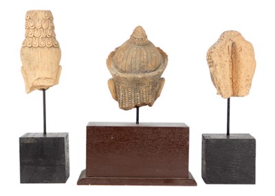 Lot 224 - Three Cambodian/Thai Buddhist pottery heads.