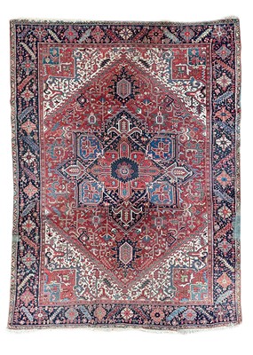 Lot 225 - A Heriz carpet, North West Persia, circa 1920.