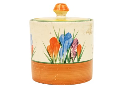 Lot 605 - A Clarice Cliff Crocus pattern drum preserve pot and cover.