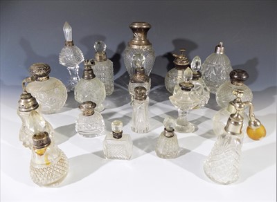 Lot 1011 - A collection of glass scent bottles and...