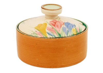 Lot 606 - A Clarice Cliff Crocus pattern shallow bon jour shape preserve pot and cover.