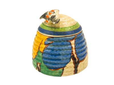 Lot 614 - A Clarice Cliff Blue Autumn pattern bee hive honey pot and cover.