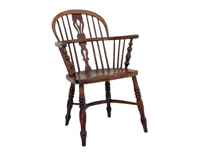 Lot 260 - An ash and elm Windsor armchair.