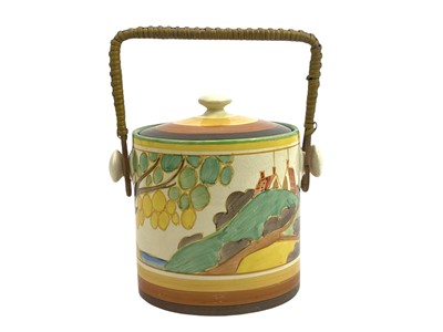 Lot 625 - A Clarice Cliff Secrets pattern Hereford shape biscuit barrel and cover.