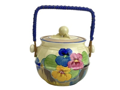 Lot 626 - A Clarice Cliff Pansies pattern 335 shape biscuit barrel and cover.