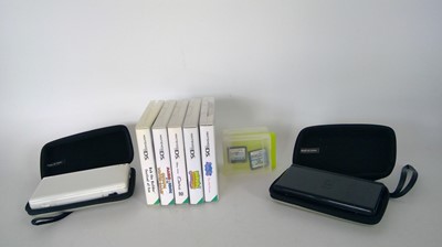 Lot 34 - Two Nintendo DS Lite game consoles, they both...