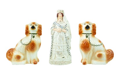 Lot 736 - A Staffordshire pottery figure of Queen Victoria.