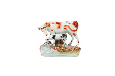 Lot 735 - A Victorian Staffordshire horse and foal spill vase.