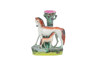 Lot 735 - A Victorian Staffordshire horse and foal spill vase.