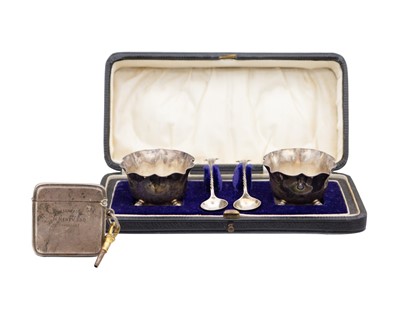 Lot 151 - A cased pair of Victorian silver salts and spoons, and a silver vesta case with watch key.