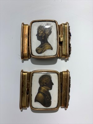 Lot 2410 - A pair of gold heightened portrait silhouettes...